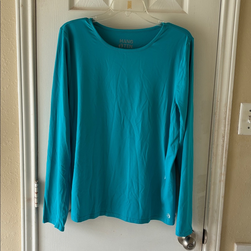 Hang Ten Bright Teal long sleeve Top with Silver Logo. NWOT